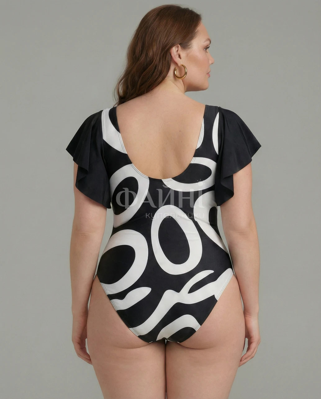 Чорно-білий купальник з оборками