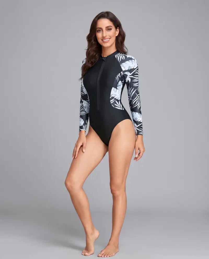 Kupalniki_com_ua 428 10 V9 Woman in black and white print swimsuit posing for photo